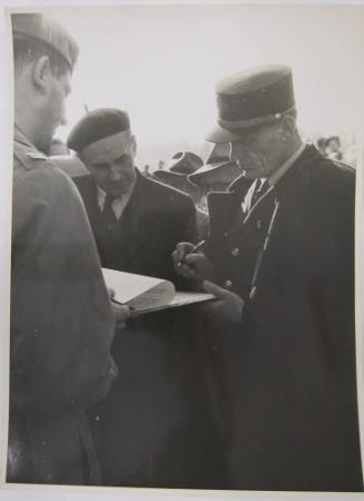 Men Sign Document