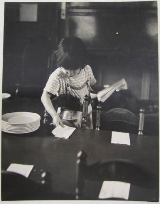 Young Girl Setting a Table