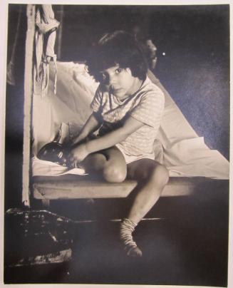Young Girl Putting her Shoes on