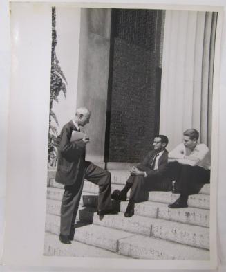 Three Men Conversing on Steps