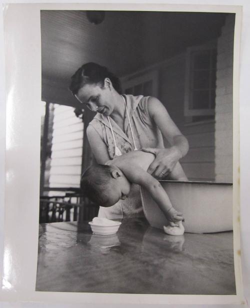 Woman Bathing Child