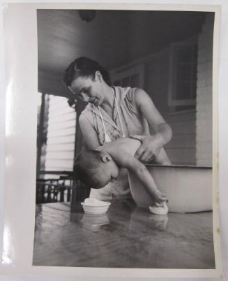 Woman Bathing Child