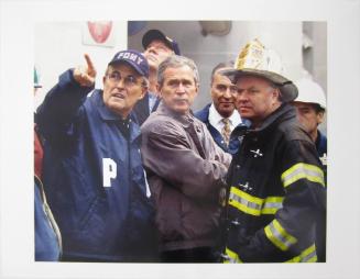 President Bush, Center, New York City Mayor Rudolph Giuliani, Left, and New York Governor George Pataki, Second from Left, Sen, Charles Schumer, D-N.Y., Second from Right, and New York City Fire Commissioner Thomas Van Essen, Right, Look Toward the Fallen Building During a Tour of the World Trade Center, Friday, September 14, 2001