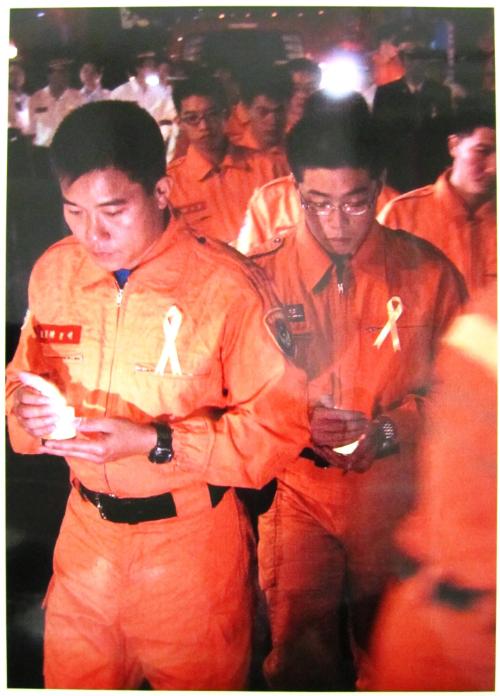 Group of Taiwanese Firefighters Hold Candles During Prayer for the Victims of the Terrorist Attacks on September 14, 2001. Some 100 Taiwanese Firefighters Showed their Support to us Firefighters after the Terrorist Attacks on September 11, 2001 on the World Trade Center in New York and on the Pentagon in Washington