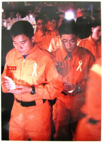 Group of Taiwanese Firefighters Hold Candles During Prayer for the Victims of the Terrorist Attacks on September 14, 2001. Some 100 Taiwanese Firefighters Showed their Support to us Firefighters after the Terrorist Attacks on September 11, 2001 on the World Trade Center in New York and on the Pentagon in Washington