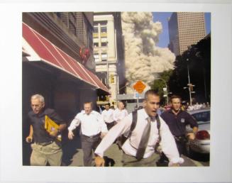 People Run From the Collapse of the World Trade Center Tower Tuesday, September 11, 2001 in New York