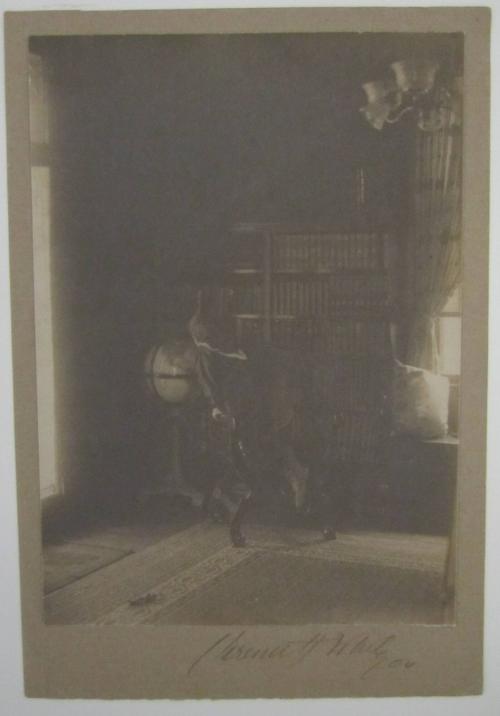 Warren S. Weiant, Jr. (Looking at Globe)