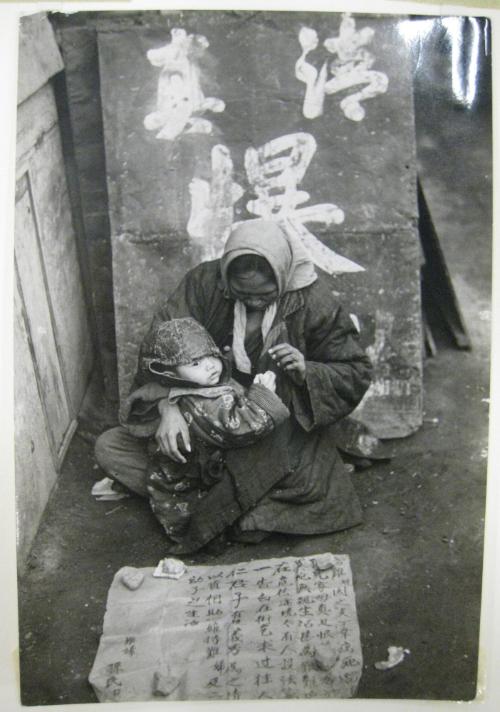 Beggar Woman and Her Child Outside a Moslem Restaurant