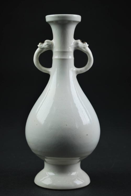 Bottle with dragon handles