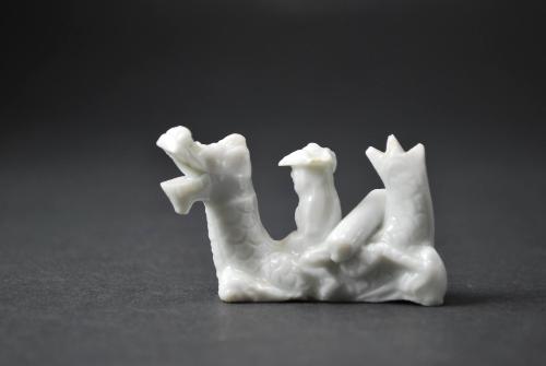 European figure with mythical creature