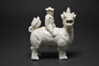 Man riding an animal (qilin)