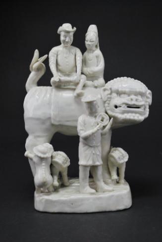 European family riding on a Buddhist lion