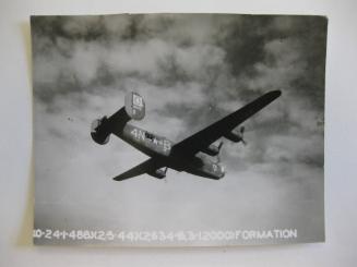 B-24 "Liberator" of the 486th Bombardment Group flies in formation, May 2, 1944