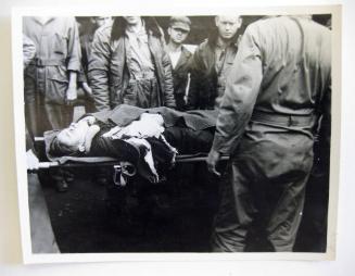 Injured crewman on a gurney, 1944-1945