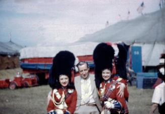 Two Performers in Scotch Garb with Circus Fan
