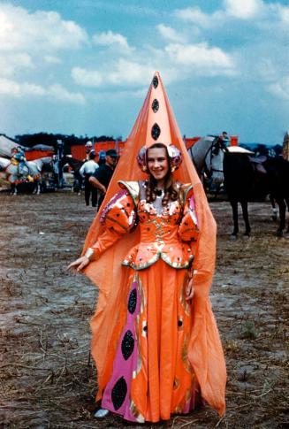 Lady in Orange Costume with Spike Headdress