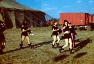 5 ladies in Black Costumes
