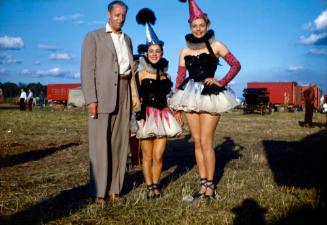 2 Ladies in Spiked Hats with a Circus Fan