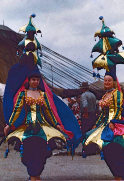 2 Female Performers in Green and Blue Costumes
