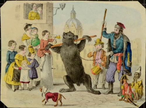 Bear performing on a crowded street.