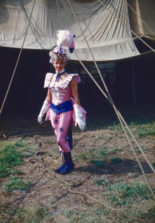 Lady in pink, white & blue costume