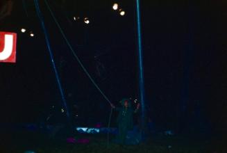 Performer in green garb under the BT