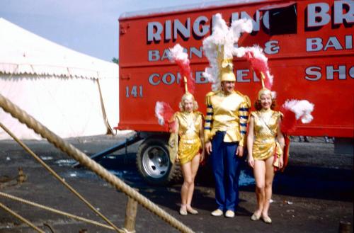 2 ladies and 1 man in gold costumes