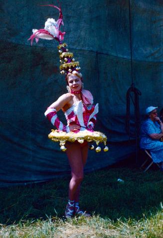 Lilly Rasmussen Plato in pink, white, and gold costume