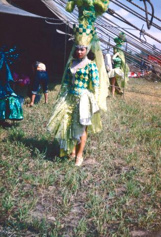 Lady in green costume in BY