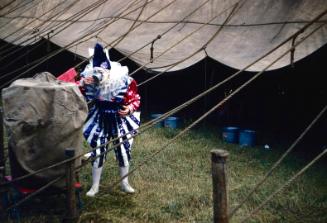 Paul Horompo in white/blue/red clown costume in BY