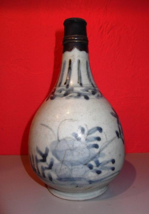 Blue-and-white bottle with silver fitting